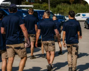 Plumbers walking to their service vans on a Wareemba job